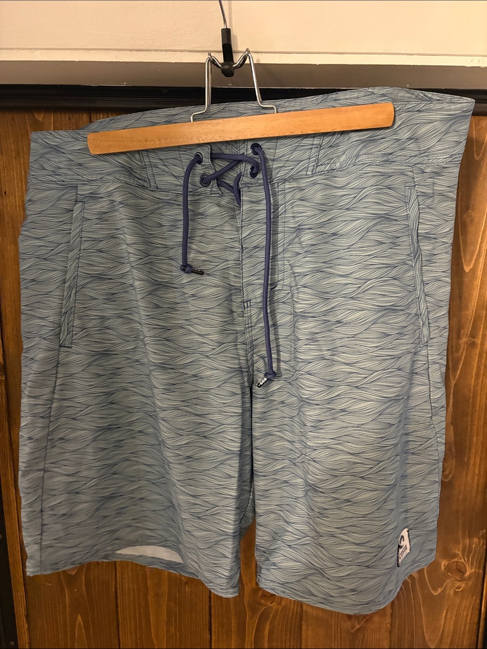 Costa Light Blue Wave-Pattern Swim Board Shorts with Navy Drawcord